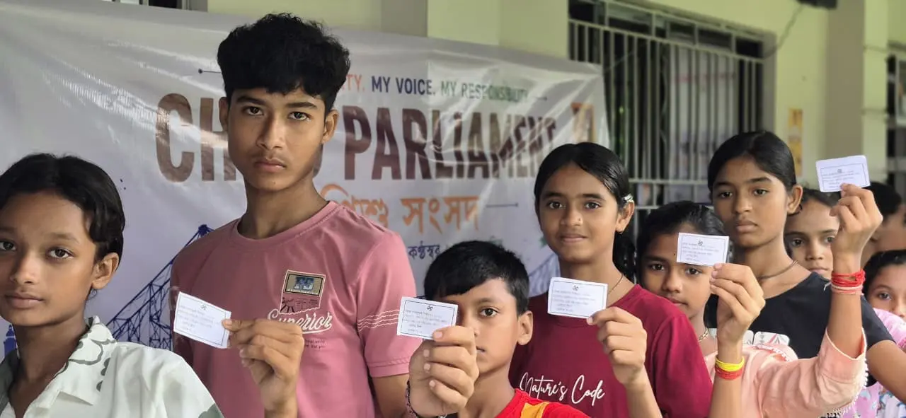 Child Parliament participants holding their member cards