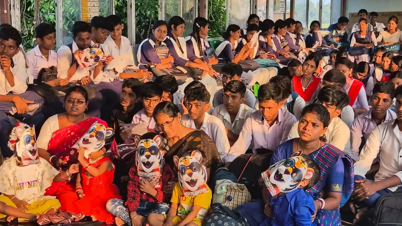 Children and adolescents taking part in a Baghu-led water-safety gathering