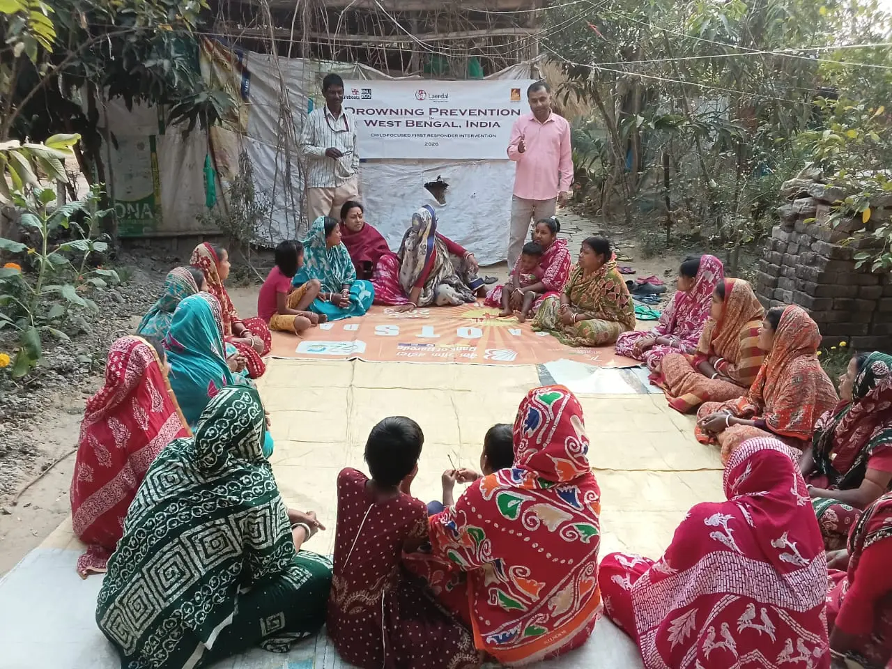 Women participating in a community drowning-prevention discussion